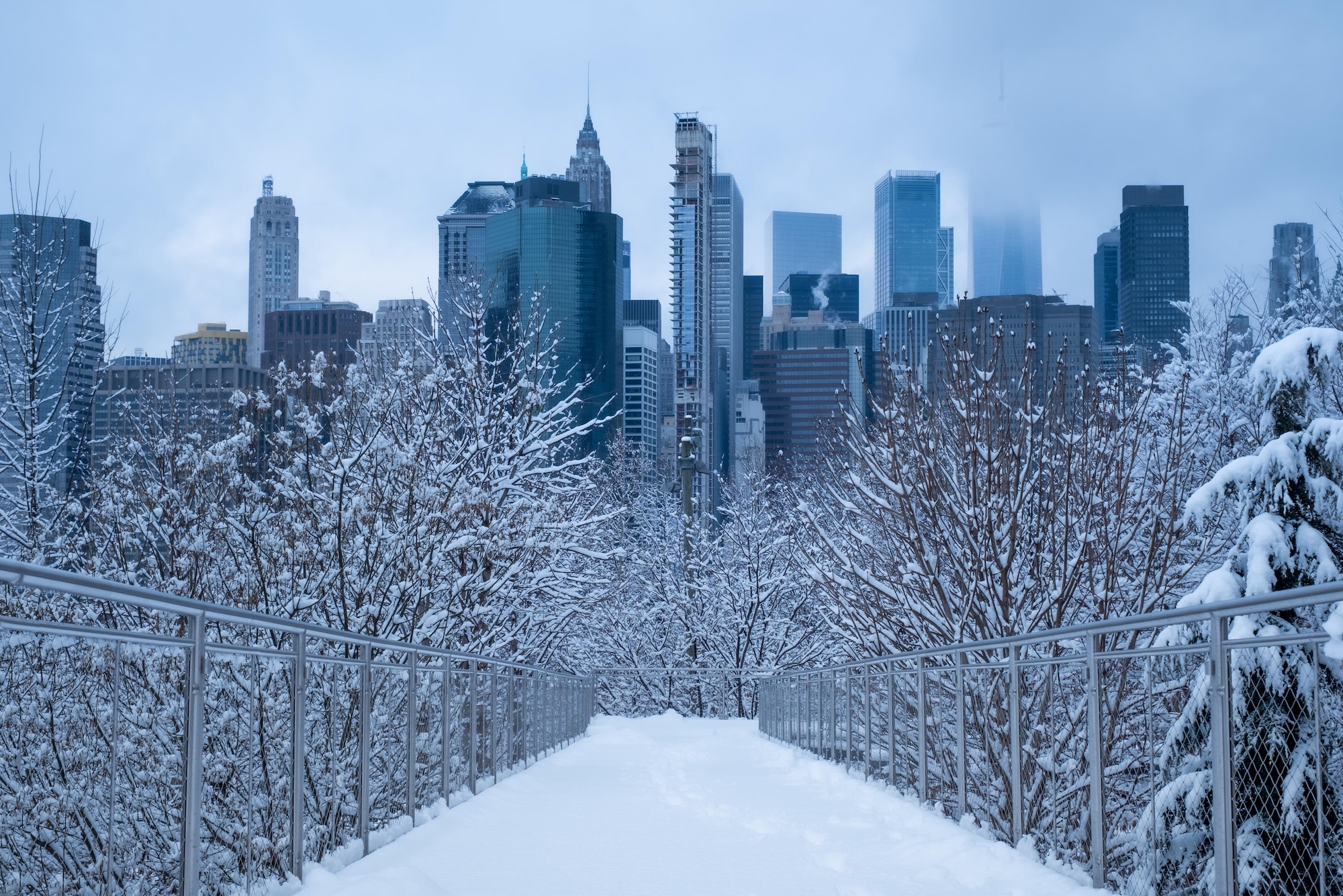 Snow-covered New York City skyline in winter